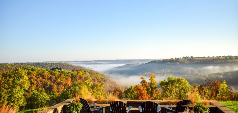 patio overlooks an Ozarks valley with fall foliage