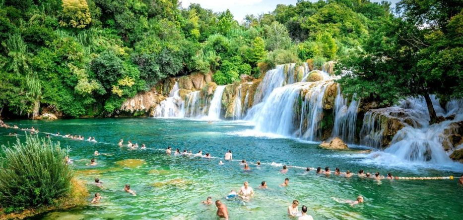 people swimming in the falls in krka national park, plitvice, croatia